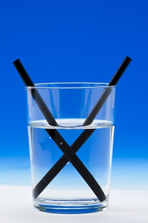 Figure 1: These seemingly "broken" straws in a glass of water result from the refraction of light.