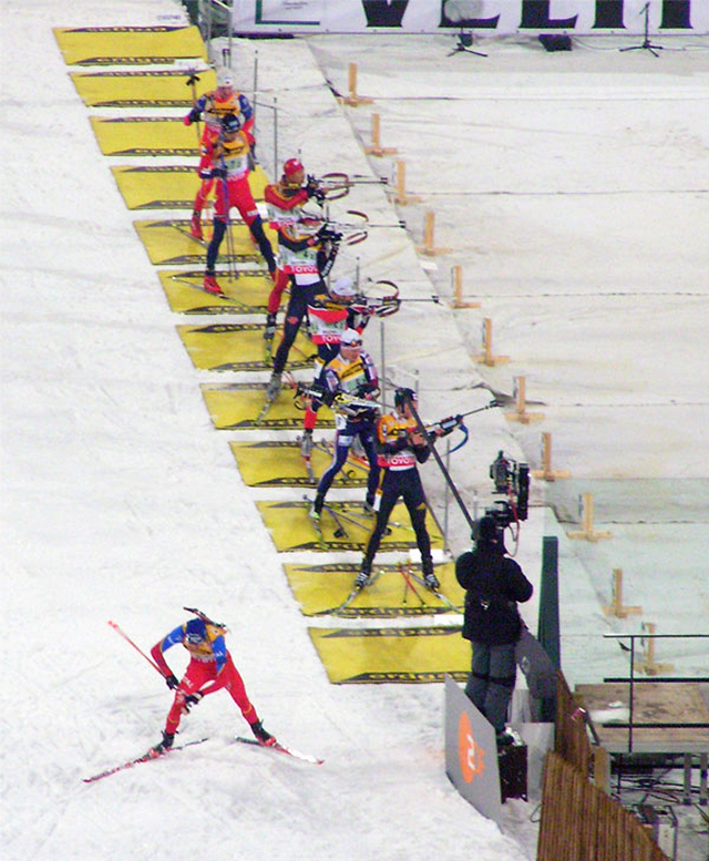 Figure 1: Biathletes in the shooting area of a competition.
